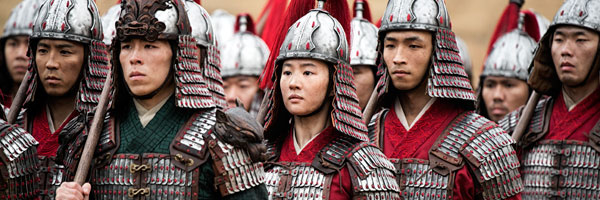 Mulan stands with her fellow soldiers in the Emperor's Imperial Army in Disney's live-action "Mulan" film