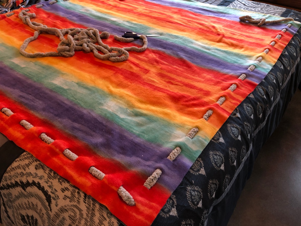 Yarn weaved into the edges of the fleece fabric